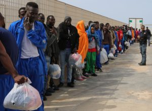 Migrants wait to board on a cruise ship as they leave the Island of Lampedusa, Southern Italy, to be transferred in Porto Empedocle, Sicily, Friday, April 17, 2015.  An unprecedented wave of migrants has headed for the European Union's promised shores over the past week, with 10,000 people making the trip. Hundreds  nobody knows how many  have disappeared into the warming waters of the Mediterranean, including 41 migrants reported dead Thursday after a shipwreck. (ANSA/AP Photo/Francesco Malavolta)
